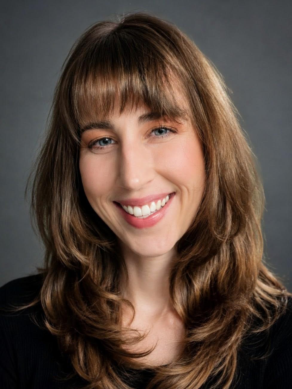 Kat Schelonka smiling in a black shirt