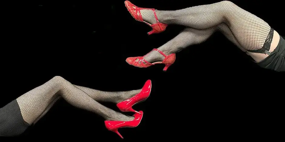 Legs in fishnets and red heels with text, The Rocky Horror Improv Show